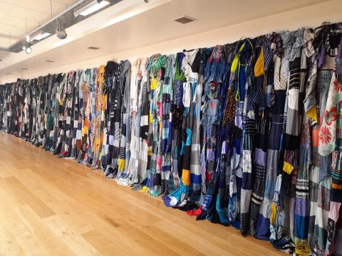 Vessels - Title: Vessels of Strength: She – Her – Womb – Warrior (2022)  Solo Exhibition: Vessels of Strength: She – Her – Womb - Warrior  Venue: Excel Gallery, Tipperary.  Medium: 365 Handstitched Textiles constructed from pre-worn women’s clothing. Dimensions: Spanned the perimeter of the gallery ( L: 64ft  W: 19ft approx..)